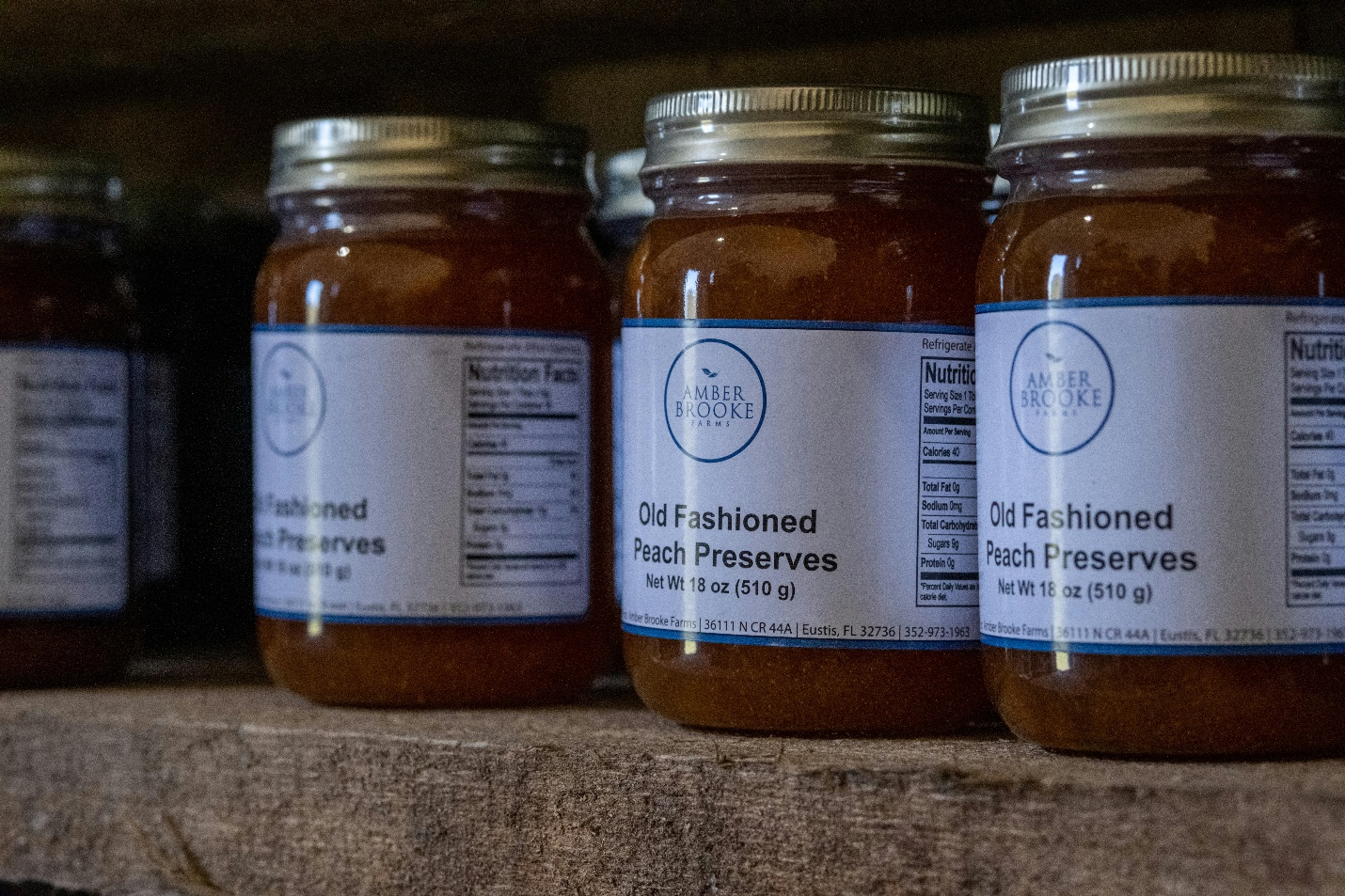 Jars of peach jams on a shelf