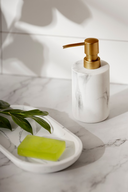 organic-shampoo-design A minimalistic shampoo bottle beside an organic soap and leaves