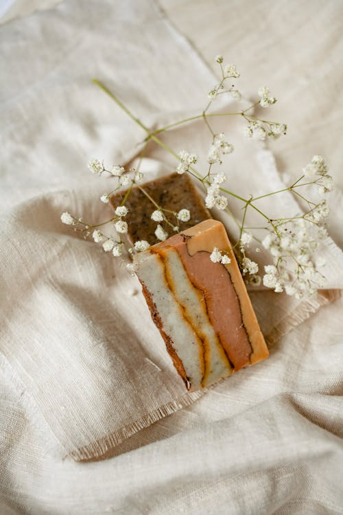 Baby's Breath flowers on brown organic bar soaps