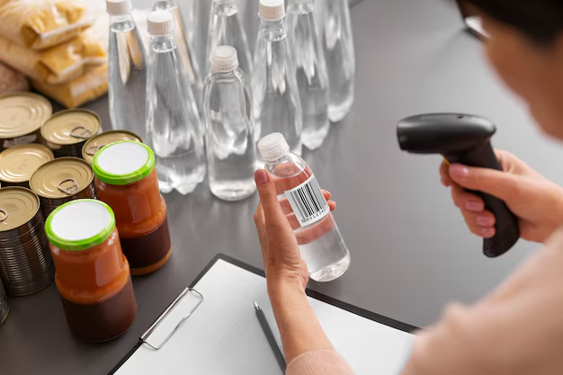 Cashier scanning a consumer packaged goods product at checkout.